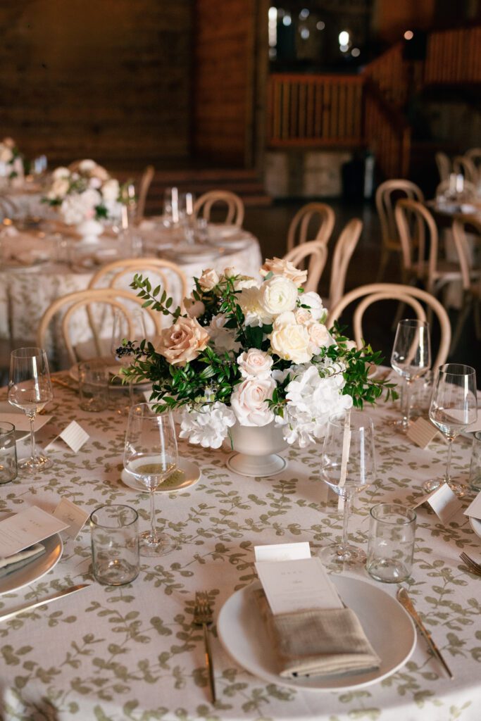 table scapes and details of the reception space, white florals and greens with overhead lighting and pattern table cloths olympias valley estate in petaluma california, wedding photography by alyssa gayle photography based in san francisco california and traveling worldwide