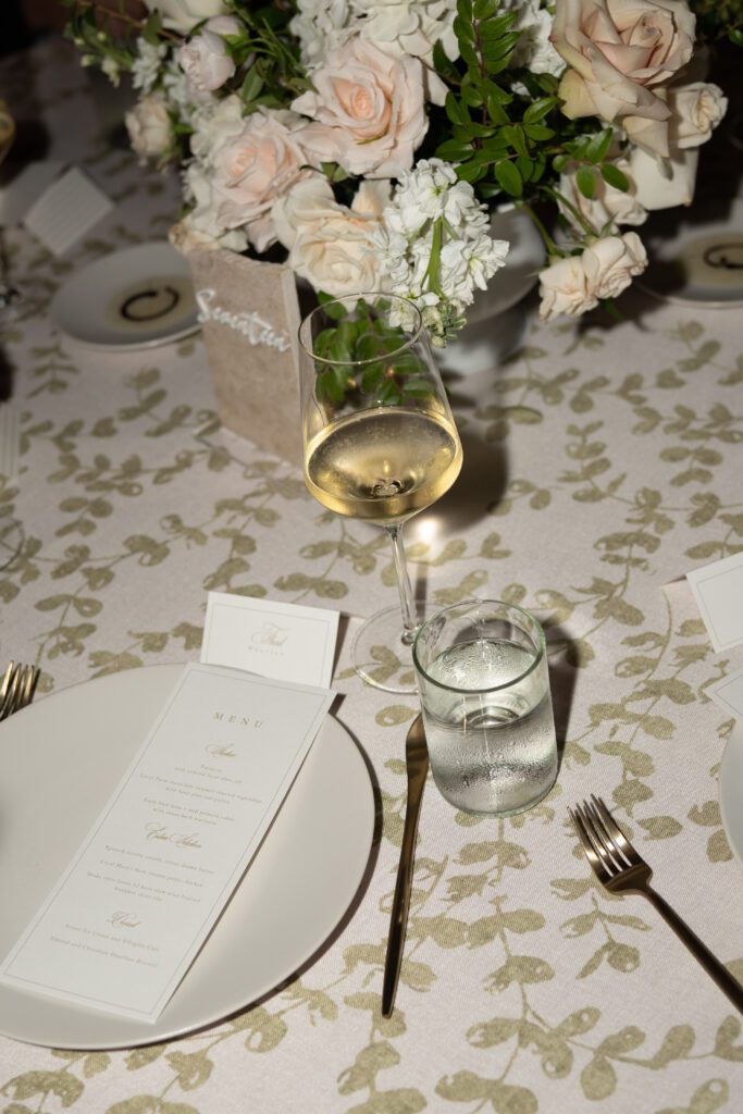 table scapes and details of the reception space, white florals and greens with overhead lighting and pattern table cloths olympias valley estate in petaluma california, wedding photography by alyssa gayle photography based in san francisco california and traveling worldwide