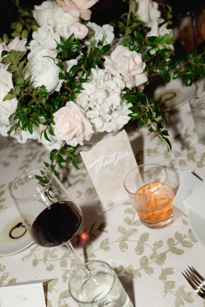 table scapes and details of the reception space, white florals and greens with overhead lighting and pattern table cloths olympias valley estate in petaluma california, wedding photography by alyssa gayle photography based in san francisco california and traveling worldwide