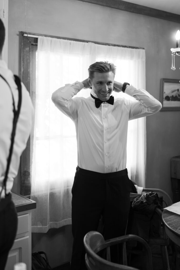 groomsmen getting ready with his black tux and bow tie olympias valley estate in petaluma california, wedding photography by alyssa gayle photography based in san francisco california and traveling worldwide