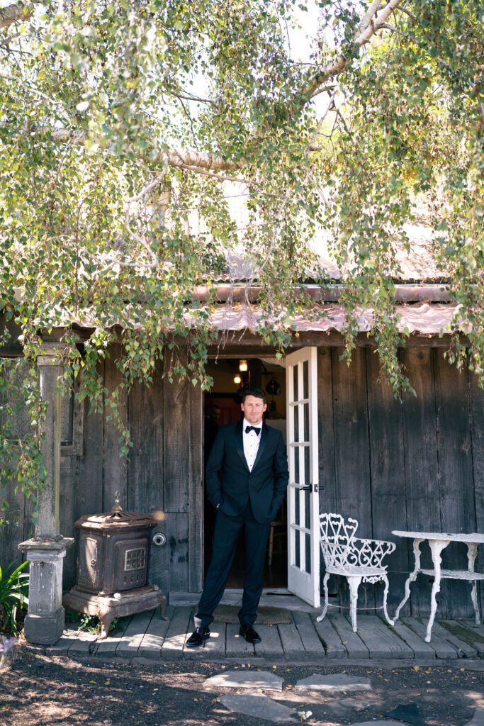 Groom getting ready for wedding outside of the cottage olympias valley estate in petaluma california, wedding photography by alyssa gayle photography based in san francisco california and traveling worldwide