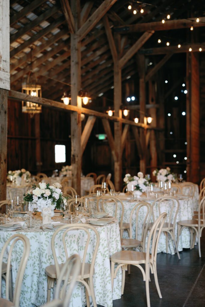 table scapes and details of the reception space, white florals and greens with overhead lighting and pattern table cloths olympias valley estate in petaluma california, wedding photography by alyssa gayle photography based in san francisco california and traveling worldwide
