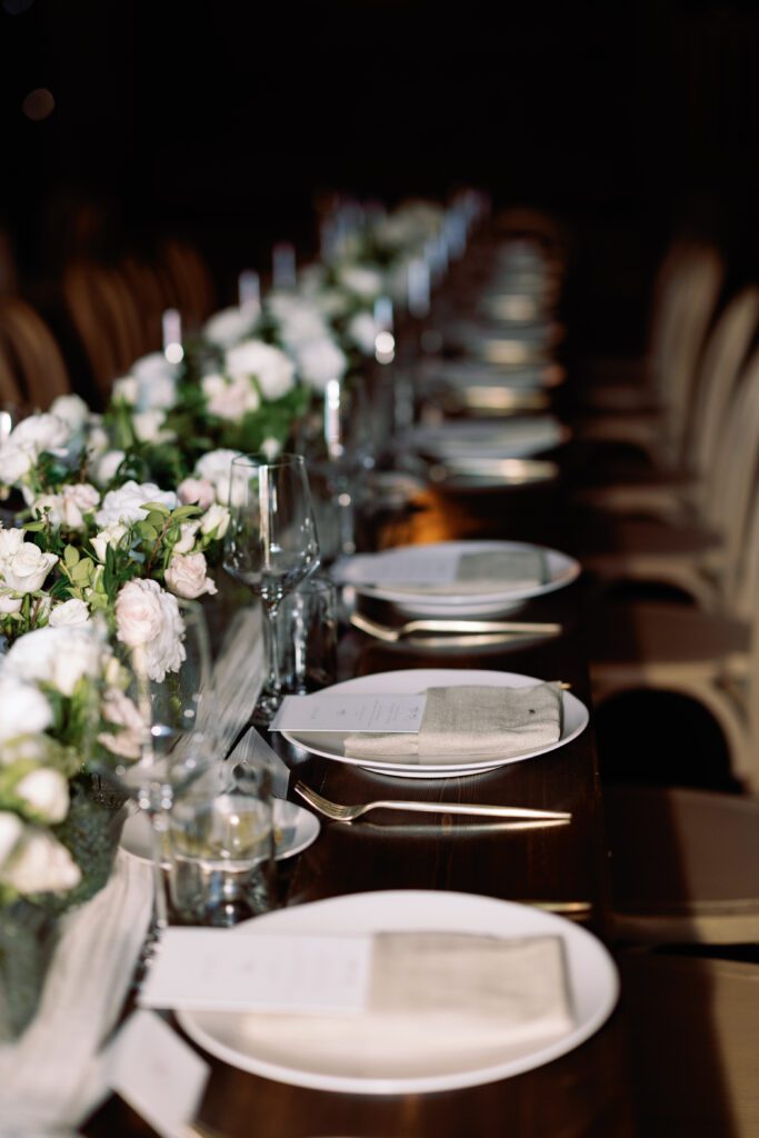table scapes and details of the reception space, white florals and greens with overhead lighting and pattern table cloths olympias valley estate in petaluma california, wedding photography by alyssa gayle photography based in san francisco california and traveling worldwide