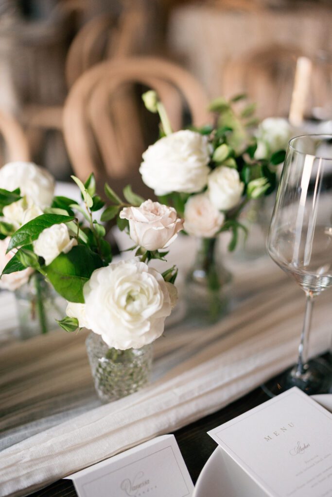 table scapes and details of the reception space, white florals and greens with overhead lighting and pattern table cloths olympias valley estate in petaluma california, wedding photography by alyssa gayle photography based in san francisco california and traveling worldwide