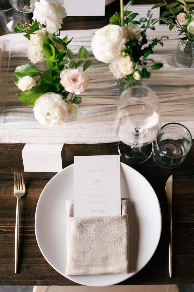 table scapes and details of the reception space, white florals and greens with overhead lighting and pattern table cloths olympias valley estate in petaluma california, wedding photography by alyssa gayle photography based in san francisco california and traveling worldwide