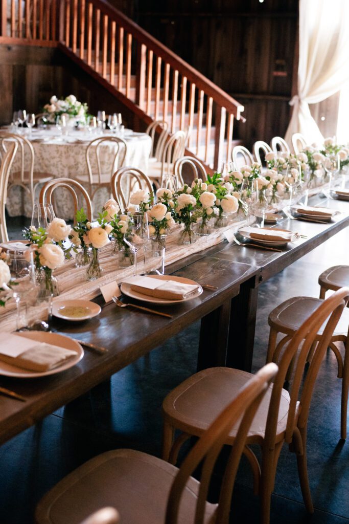 table scapes and details of the reception space, white florals and greens with overhead lighting and pattern table cloths olympias valley estate in petaluma california, wedding photography by alyssa gayle photography based in san francisco california and traveling worldwide