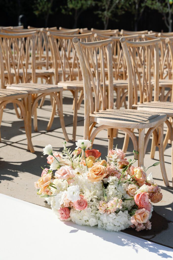 Outdoor ceremony chairs with floral arrangement at Jacuzzi Winery wedding in Sonoma
