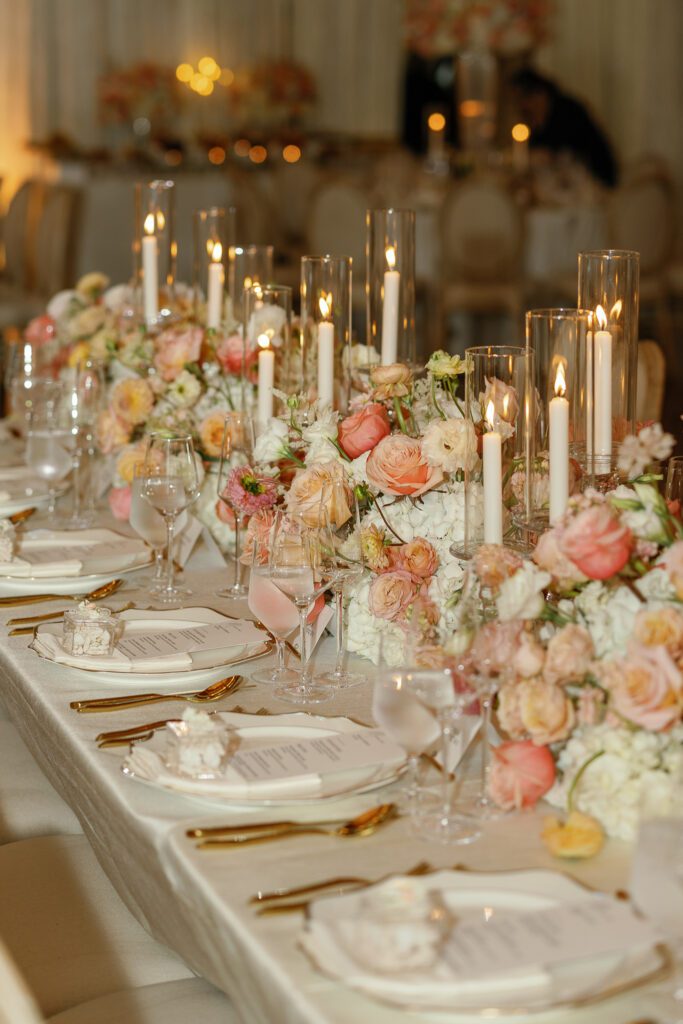 Candlelit wedding reception table with floral design by Florals by Hamid at Jacuzzi Winery
