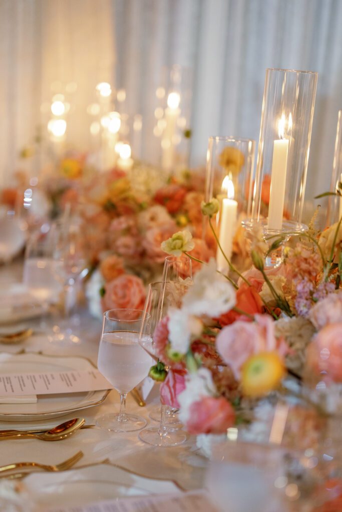 Romantic wedding reception florals and candles designed by Florals by Hamid at Jacuzzi Winery
